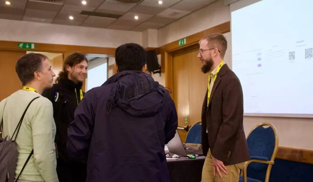 Daniel talking with attendees after the presentation.